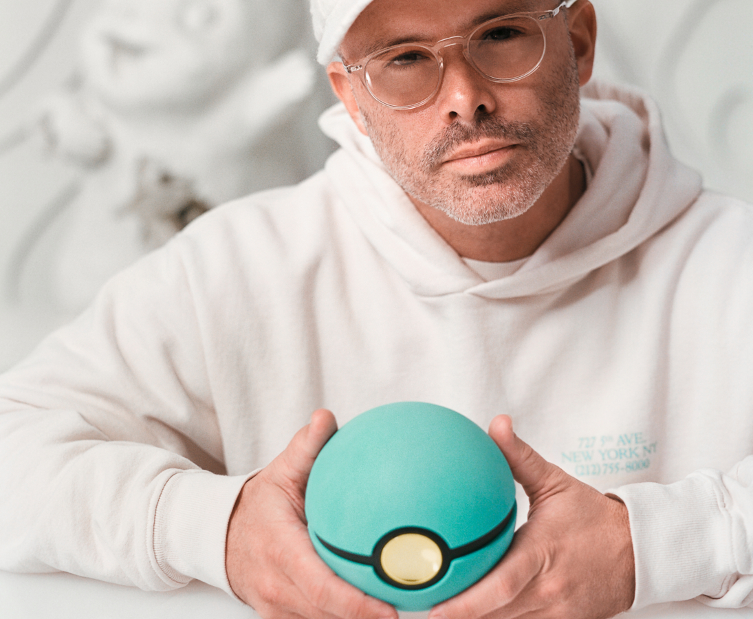 Contemporary artist Daniel Arsham holding the Tiffany & Arsham Studio & Pokémon nabuka Poké Ball packaging.