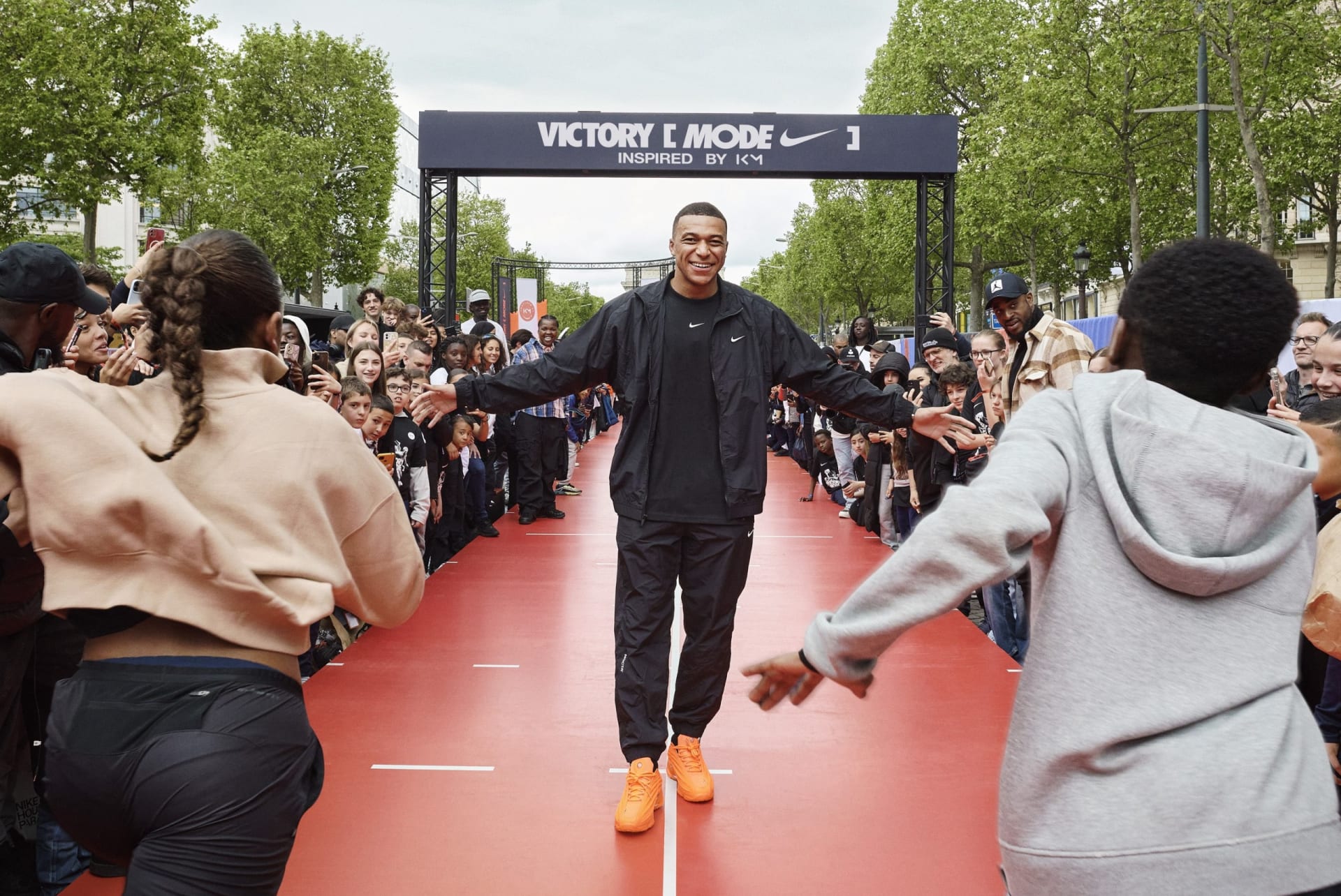 Nike - Victory Mode Tour launch- Football icon Kylian Mbappé and his foundation, IBKM, kicked off Nike’s “Victory Mode” tour by hosting a multisport event for young athletes in front of the Nike House of Innovation in Paris on May 5, 2024. Kylian is seen here with his brother Ethan Mbappé. Photo: Nike Inc