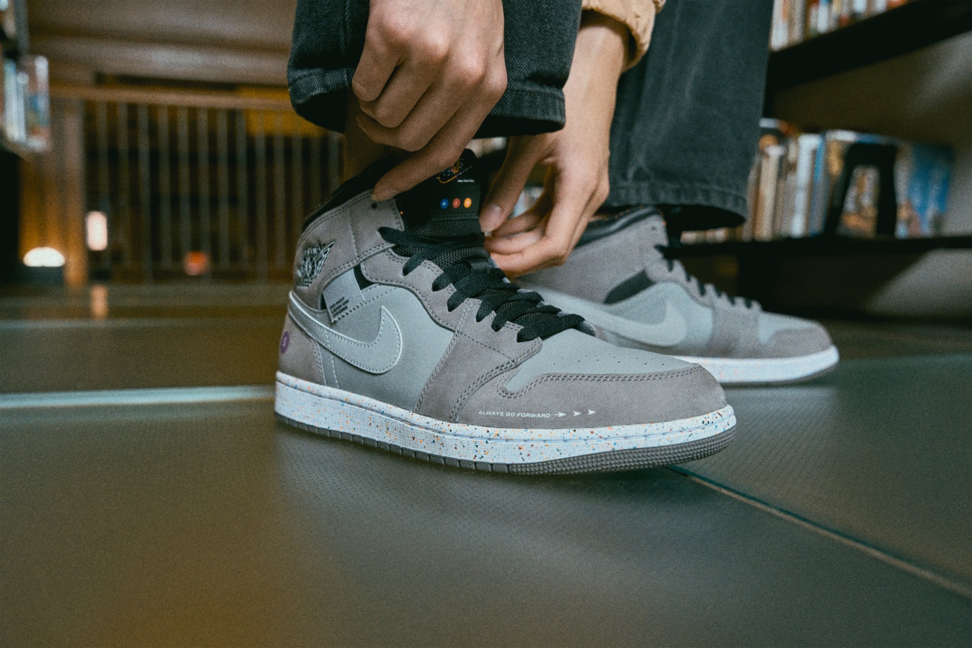 Nike - Air Jordan I Mid Subway- The reflective Swoosh symbolizes the reflective stripes on MTA trains; the secondary laces are also reflective. The gray and black upper is a nod to the colors of the train, built with water-resistant leathers for durability during New York City weather. Photo: Nike Inc