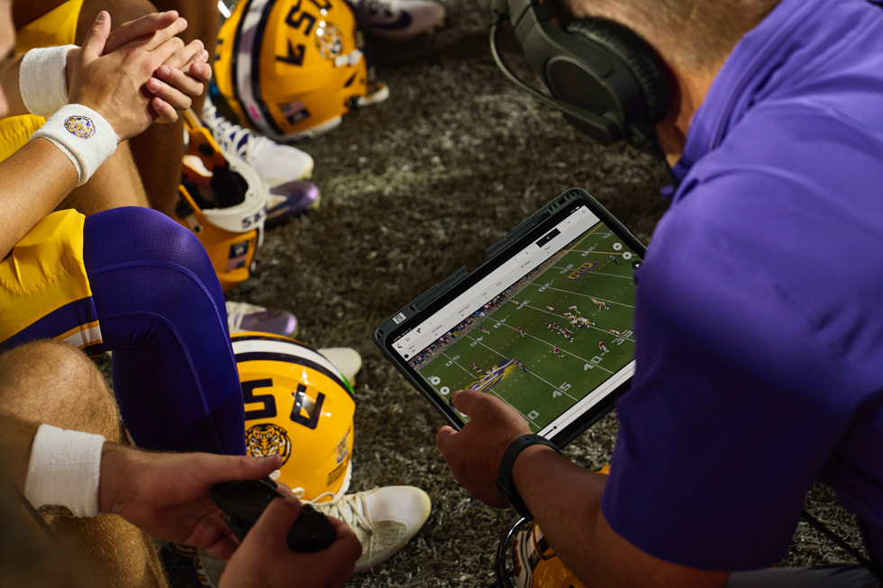 The new NCAA rule allows teams to use iPad on the sidelines, in the coaching booth, and in the locker room. - Courtesy of Apple