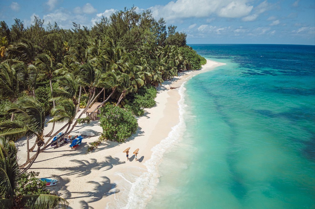 Find winter warmth on the uninterrupted shores of Desroches Island, Seychelles.