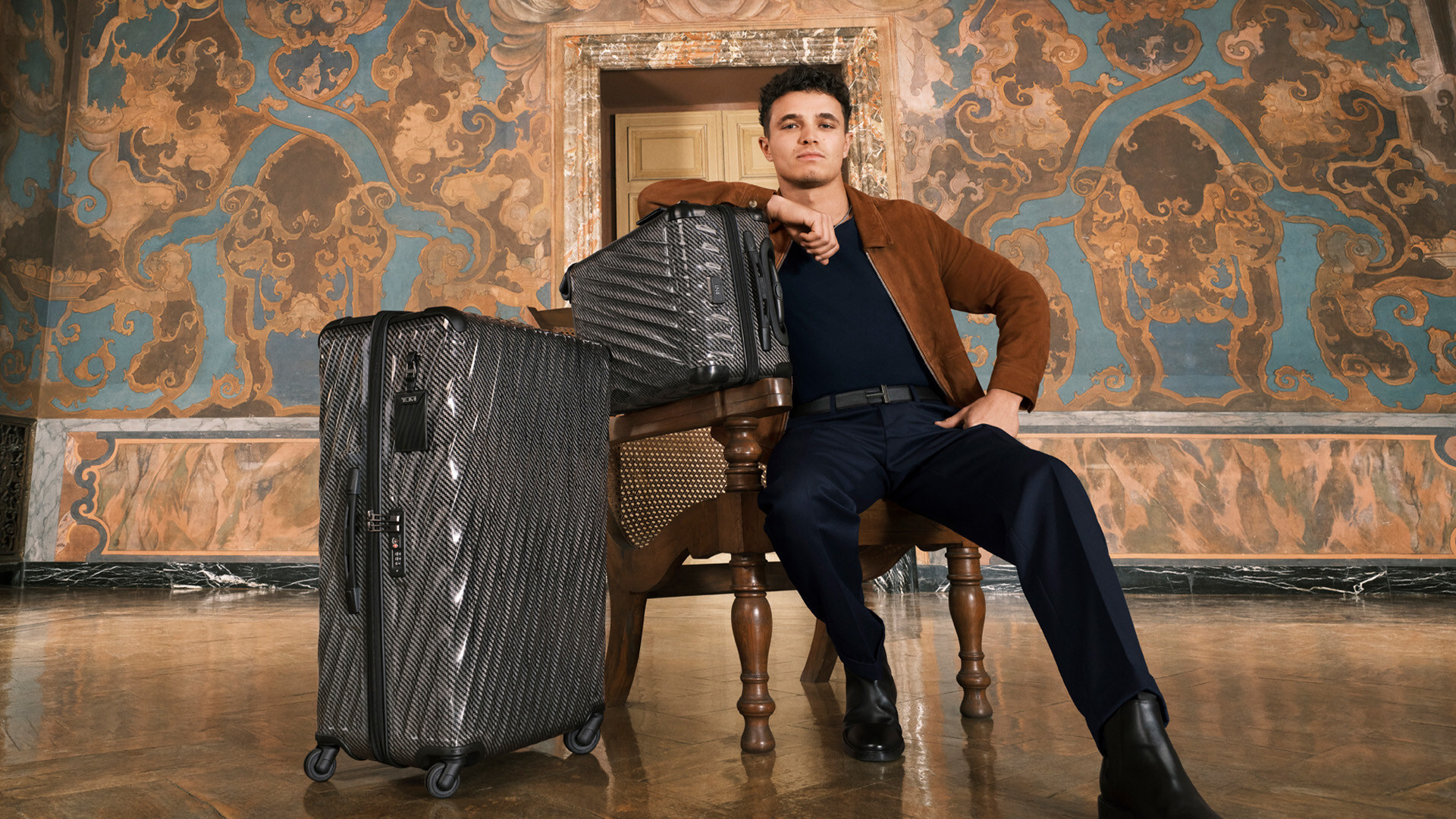 Lando Norris with 19 Degree Lite International 4 Wheeled Carry-On and Extended Trip 4 Wheeled Packing Case in Black Graphite